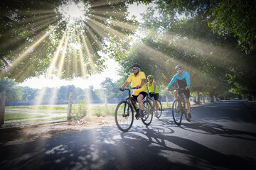 Confident cyclists riding bicycle on countryside road
