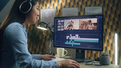 Wall Mural - asian woman in headphones working remotely on pc from home office and editing video with astronauts 