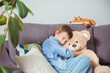© irena_geo - Close up lonely little boy hugging toy, sitting at home alone, upset unhappy child waiting for parents, thinking about problems, bad relationship in family, psychological trauma