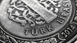 Translation: Turkish lira. Fragment of 1 lira coin close up. National currency of Turkey. Black and white illustration for news about economy or finance. Money and bank in Turkey. Macro