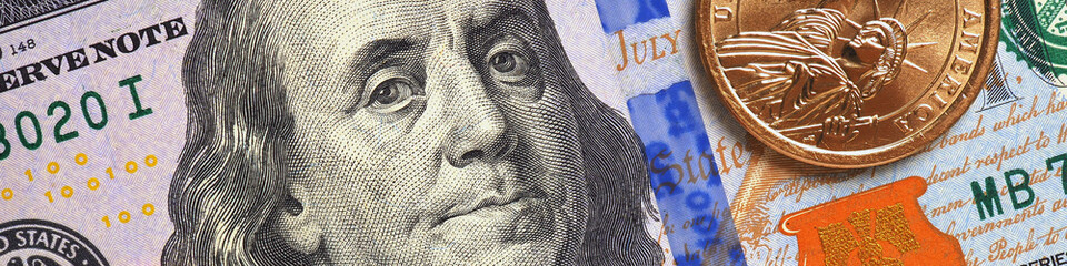Wall Mural - american money close-up. 100 dollar banknote and 1 dollar coin. benjamin franklin and statue of libe