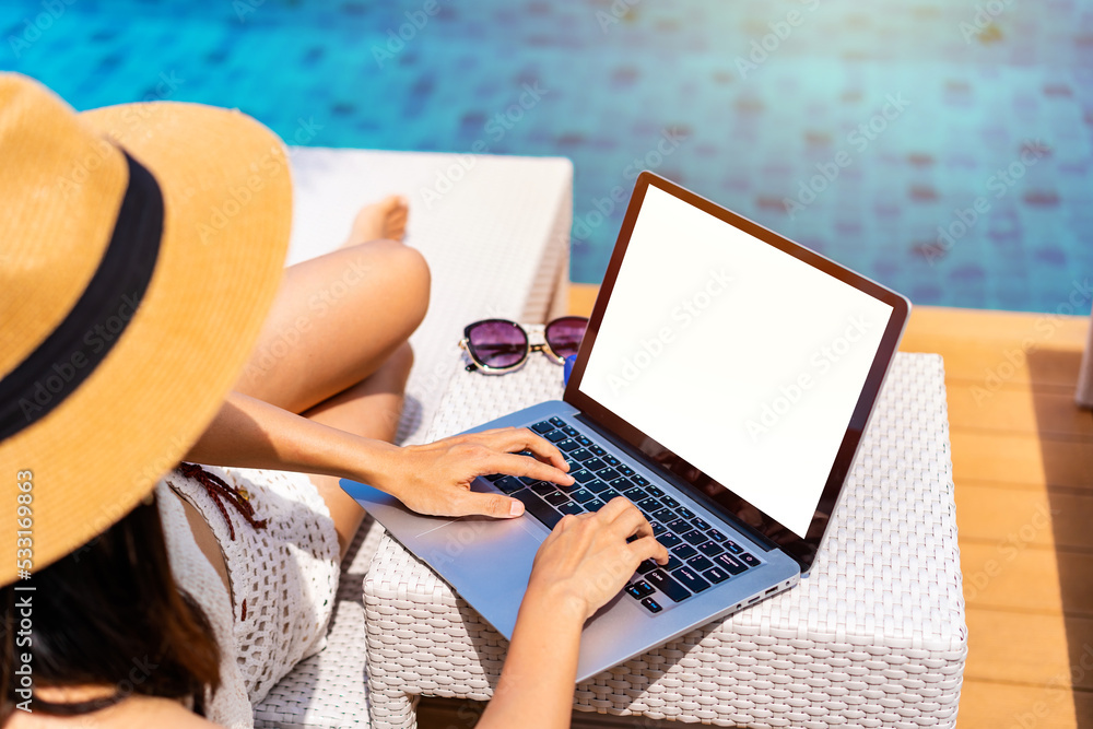 Young woman freelancer traveler working online using laptop while ...