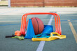 Sports equipment for sufficient quality training and fun. Basketball, jump rope, hurdles, blue cones, rubber bands, expanders. Sports outdoor playground