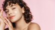 Skin care and beauty. Close up of smiling girl, 25 years face, glowing face after nourishing gel, facial cream, pink background