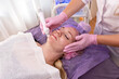 © Irina - Beautiful woman getting face vacuum procedure for healthy skin in spa salon.