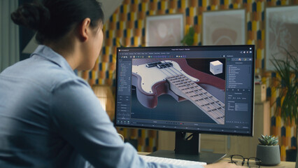 Wall Mural - woman designing 3d prototype of electric guitar using modern personal computer with 3d modeling prog