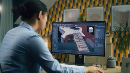 Wall Mural - woman designing 3d prototype of electric guitar using modern personal computer with 3d modeling prog
