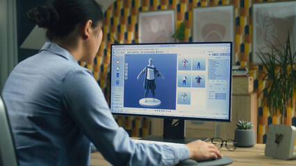 Female 3D designer having remote work on 3D modeling and creating 3D visualization of clothes using pc and professional program