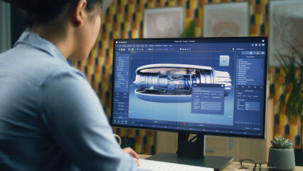Wall Mural - female 3d designer using pc with professional program and creating 3d prototype of airplane turbine 