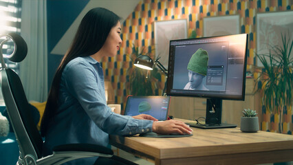 Wall Mural - female asian 3d designer having remote work on 3d modeling and creating 3d visualization of clothes 