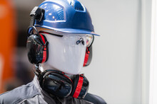 PPE - Industrial Work Safety and Personal Protection Equipment on Display. Safety helmet and anti-noise earmuffs