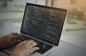 Digital technology, software development, IoT concept. Woman programmer, software developer working on laptop computer and smart city with big data, programming code.