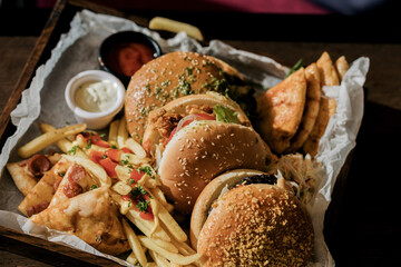 hamburgers and french fries with sauce