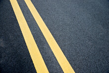 Double Yellow Lines On Asphalt Road