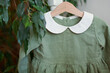© Westend61 - Green dress in hanger at store