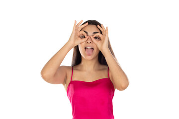 Wall Mural - Young brunette woman looking through her fingers as they were glasses