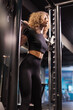 Sportswoman works out in the gym