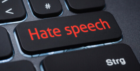Wall Mural - illuminated keyboard with a labeled key - hate speech