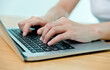 © xy - Woman hand typing on a laptop