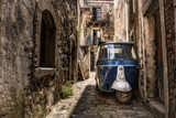 Fototapeta Morze - Piaggio Ape in a narrow street of an old town in Sicily, Italy.