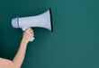 © xy - Woman holding megaphone on chalkboard