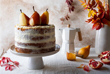 Fall Ginger Cake Decorated With Spicy Poached Pears And Caramel Sauce. Creamy Naked Cake On Cake Stand.