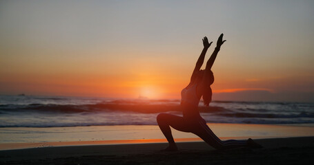 woman practice yoga on beach