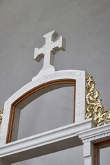 Cross with decorative elements of the church iconostasis. Culture and religion.