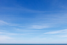 Beautiful Blue Sky With Cirrus Clouds Over The Sea. Skyline.