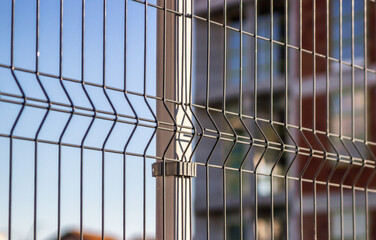 Wall Mural - Steel grating fence made with wire. 