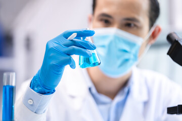 Sticker - blue chemical liquid experiment in scientific glassware equipment in science medicine laboratory, chemistry or biology research discovery by using glass of test tube or beaker and flask