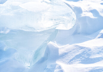 Wall Mural - Ice hummocks on Baikal Lake. Transparent blue ice floe at sunset. Natural background.