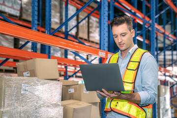 Wall Mural - Smart smiling caucasian warehouse man,worker,manager use laptop to check goods on shelf for product distribution stock management, Logistics shipping business planning concept with copy space