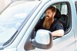 © Krakenimages.com - Young irish man smiling happy driving car at the city.