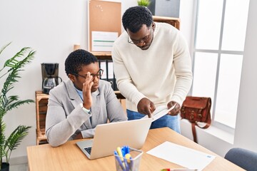 Canvas Print - Man and woman business workers using laptop working at office