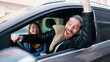 © Krakenimages.com - Man and woman couple smiling confident driving car at street