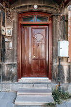 Old Classical Stone House With Rustic, Brown, Carved, Vintage Wooden Door. Door Textures And Backgound.