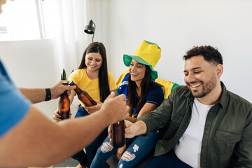 Wall Mural - Host bringing beers to group of friends watching a football match on TV