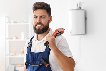 Poster - Male plumber with pipe wrench in bathroom