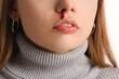 © Pixel-Shot - Young woman with nosebleed on white background, closeup