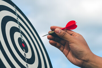 Wall Mural - Bullseye has red dart arrow throw hitting the center of a shooting for business. targeting and winning goals business.