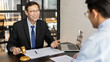 © Puwasit Inyavileart - Attorney or judge provides legal advice to the client in the courtroom, Ethics in the courts include justice and impartiality, Legal consultant, Scales of justice, Law hammer, Litigation and justice.