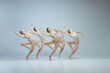 © Lustre Art Group  - Group of young girls, ballet dancers performing, posing isolated over grey studio background. Flexibility, attraction, grace