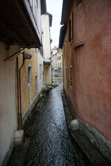 Canvas Print - view of the old colorful buildings of the town of annecy france by the river 