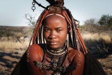 Portrait Of A Himba Woman Dressed In Traditional Style In Namibia, Africa.