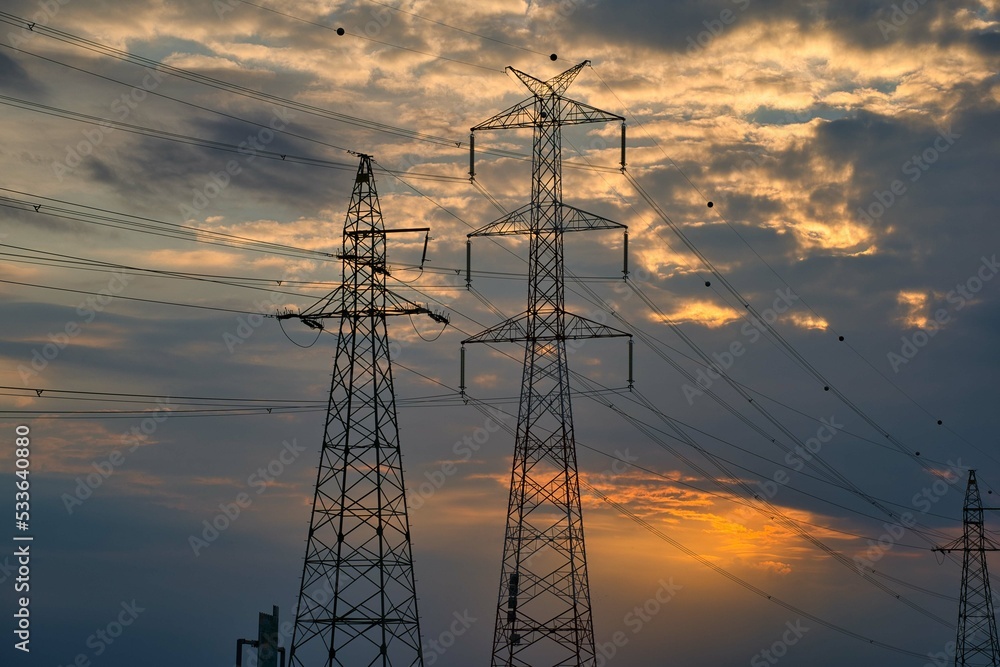 High Voltage Electric Pylons And Electrical Wires on the sunset ...