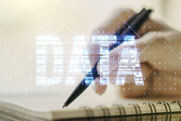 Wall Mural - creative data word hologram and woman hand writing in notebook on background, big data and blockchai