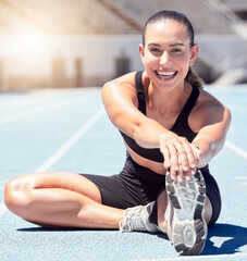 happy fitness or sports woman stretching at stadium in sunshine lens flare for healthy lifestyle and