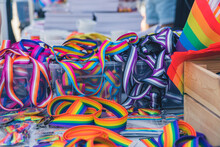 LGBT Pride Parade In Warsaw, Poland, On June 25, 2022. People Selling Mini LGBTQ Flags, Rainbow Wristbands, Belts And Other Accessories. High Quality Photo