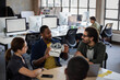© ReeldealHD images - African American male game designer leading a meeting